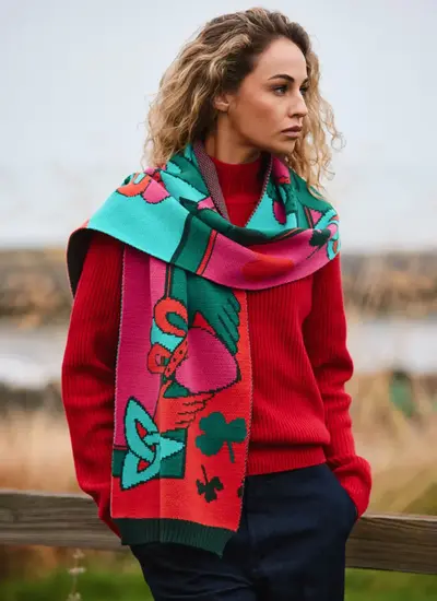 Woman wearing a Patrick Francis Claddagh Knit Scarf with Trinity Knots 